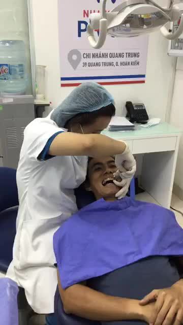 KH chỉnh nha mắc cài kim loại tự buộc tại Nha khoa Paris Quang Trung