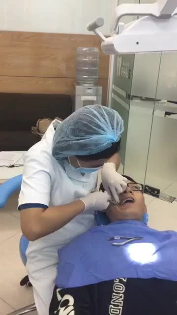 KH chỉnh nha mắc cài kim loại thường sau 9 tháng tại nha khoa Paris Quang Trung.